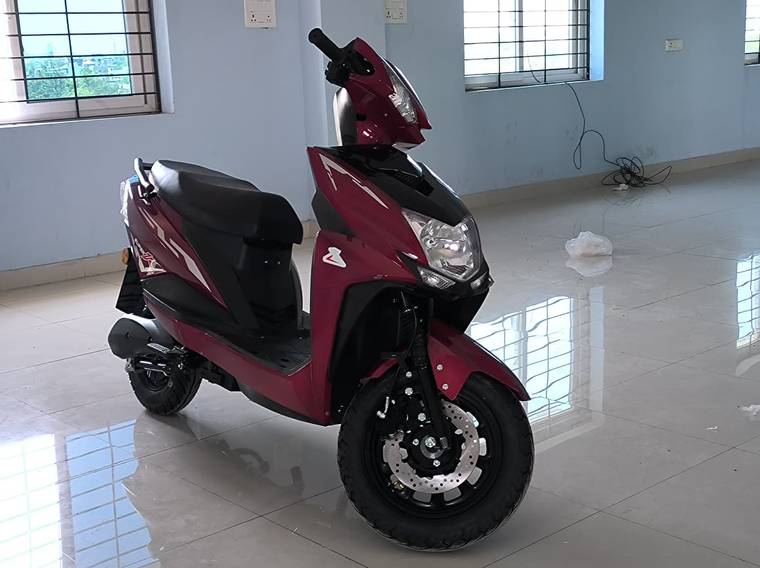 Wine Red scooter in the showroom