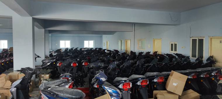 Warehouse stocked with Excon scooters ready for dealers