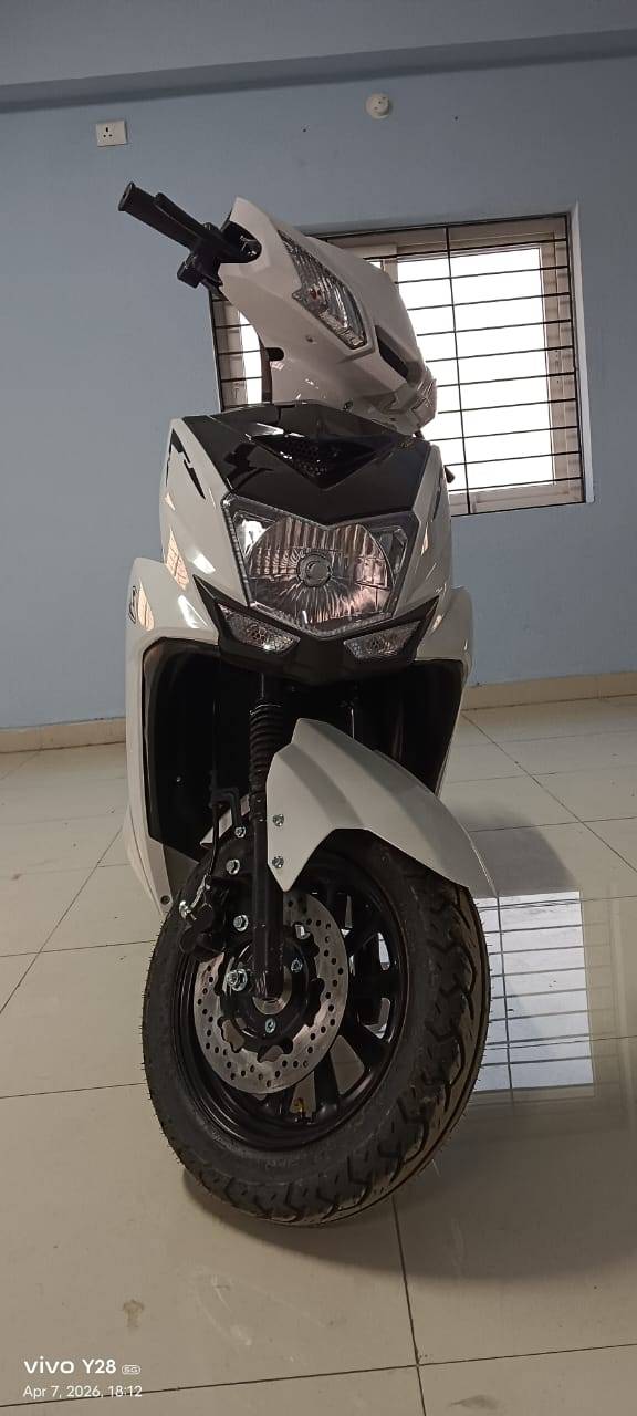 White scooter front view showing disc brake